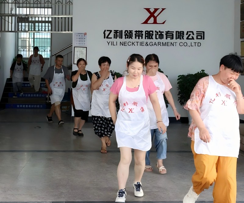 YILI employees evacuating in an orderly manner during fire drill at the necktie factory